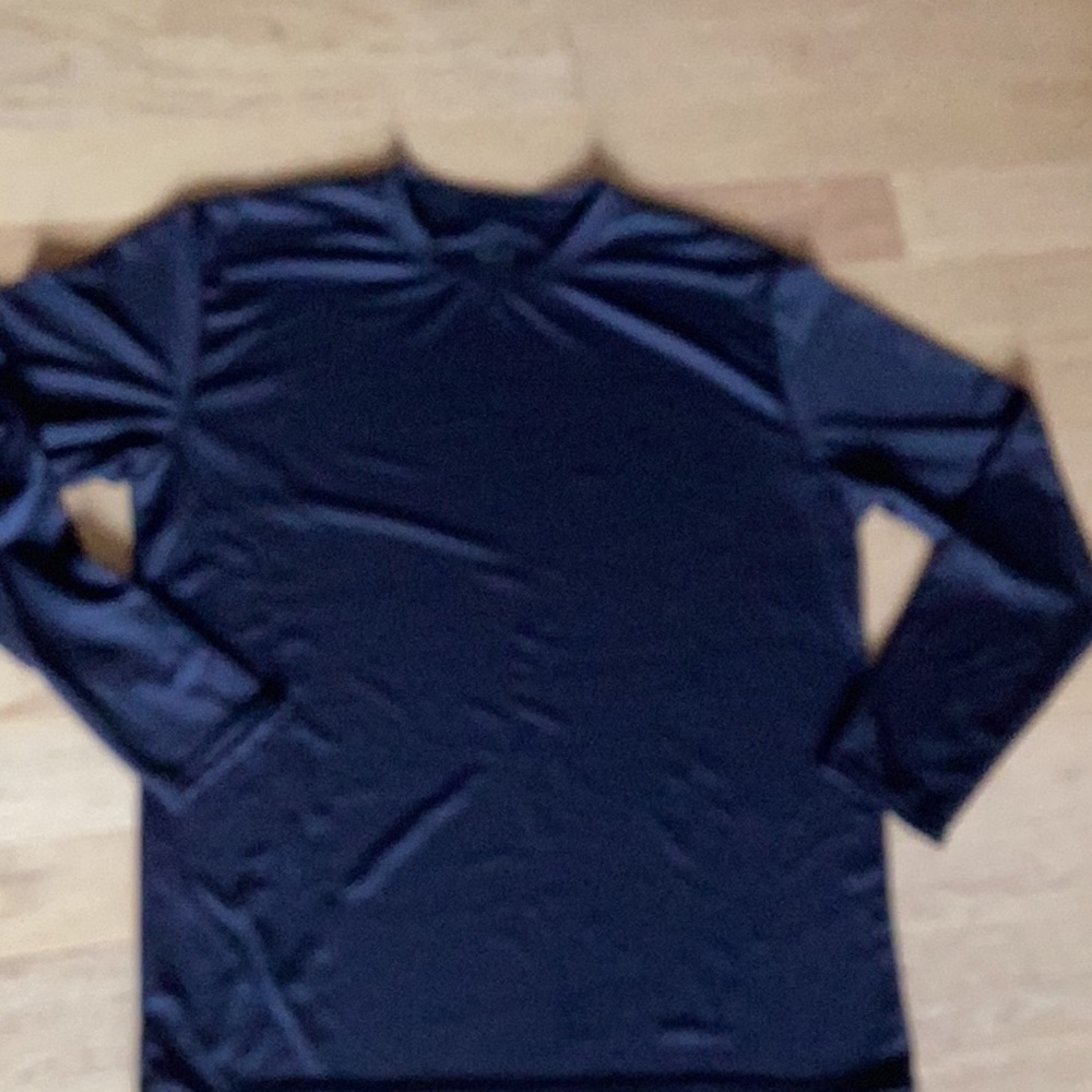 Moisture wicking long sleeve polyester tee.  Size large but runs small. NEW